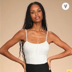 Cue the candlelight white sleeveless lace body suit